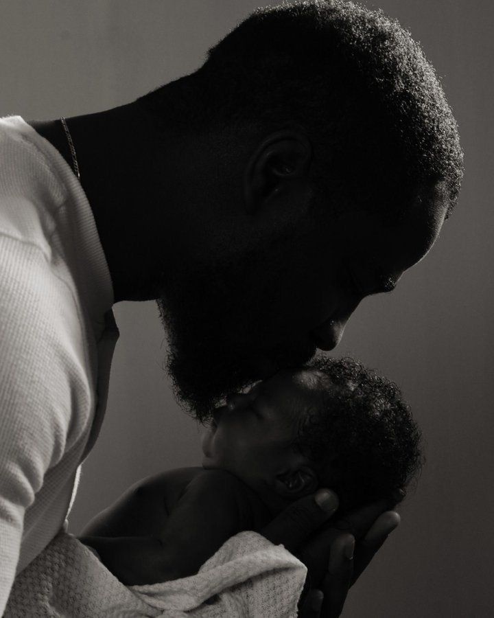 Father holding his newborn baby
